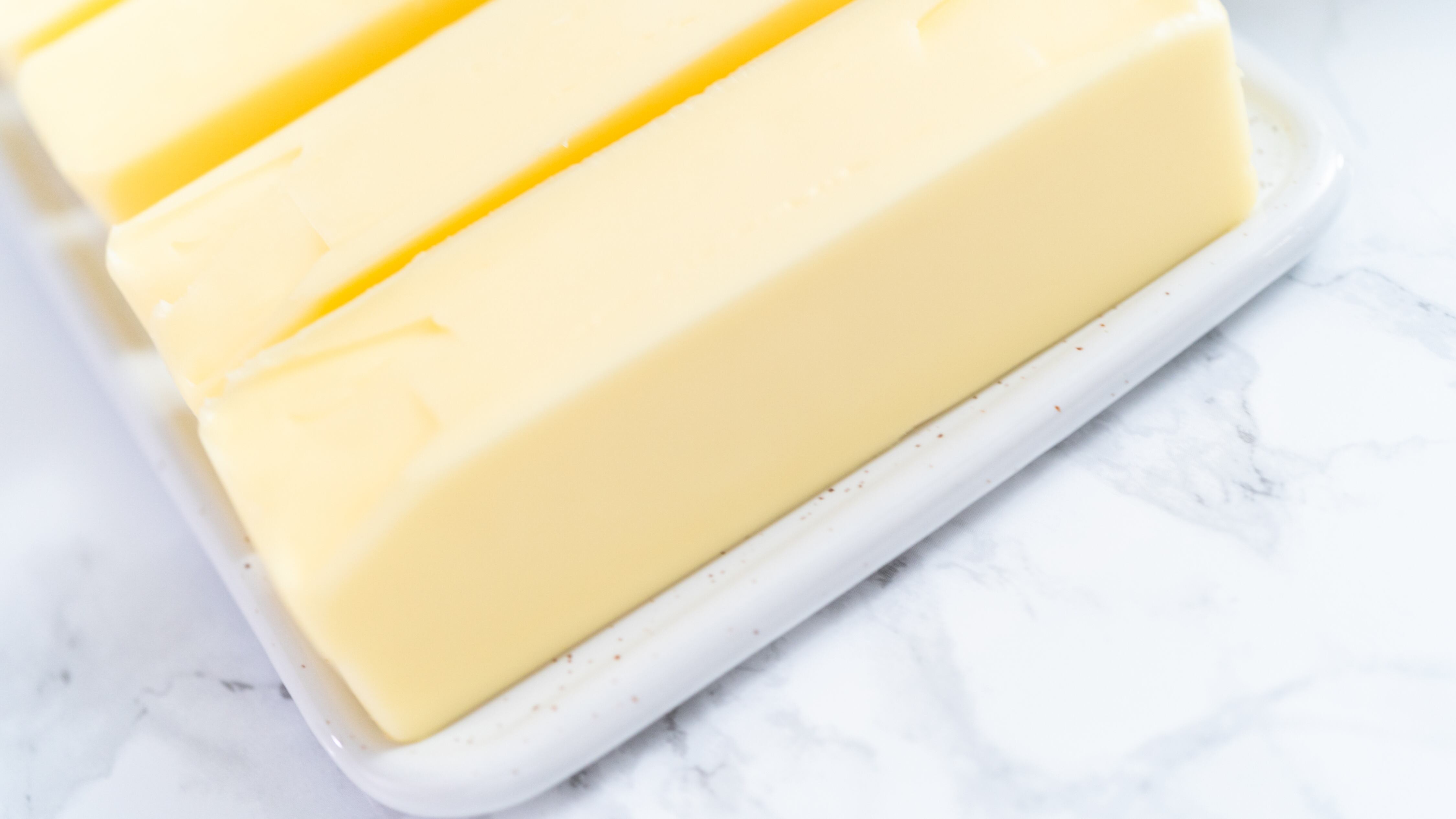 Sticks of butter at room temperature for baking.